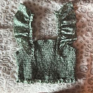 Green top with white flowers.